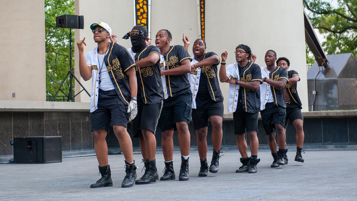 Gentlemen from Purdue's Gamma Rho fraternity showcase their chapter's history through steps, strolls, chants and dancing at the National Pan-Hellenic Council Yard Show in 2021. Photo credit: Mary Icenogle, Marketing and Photography Coordinator student intern, Fall 2021. 