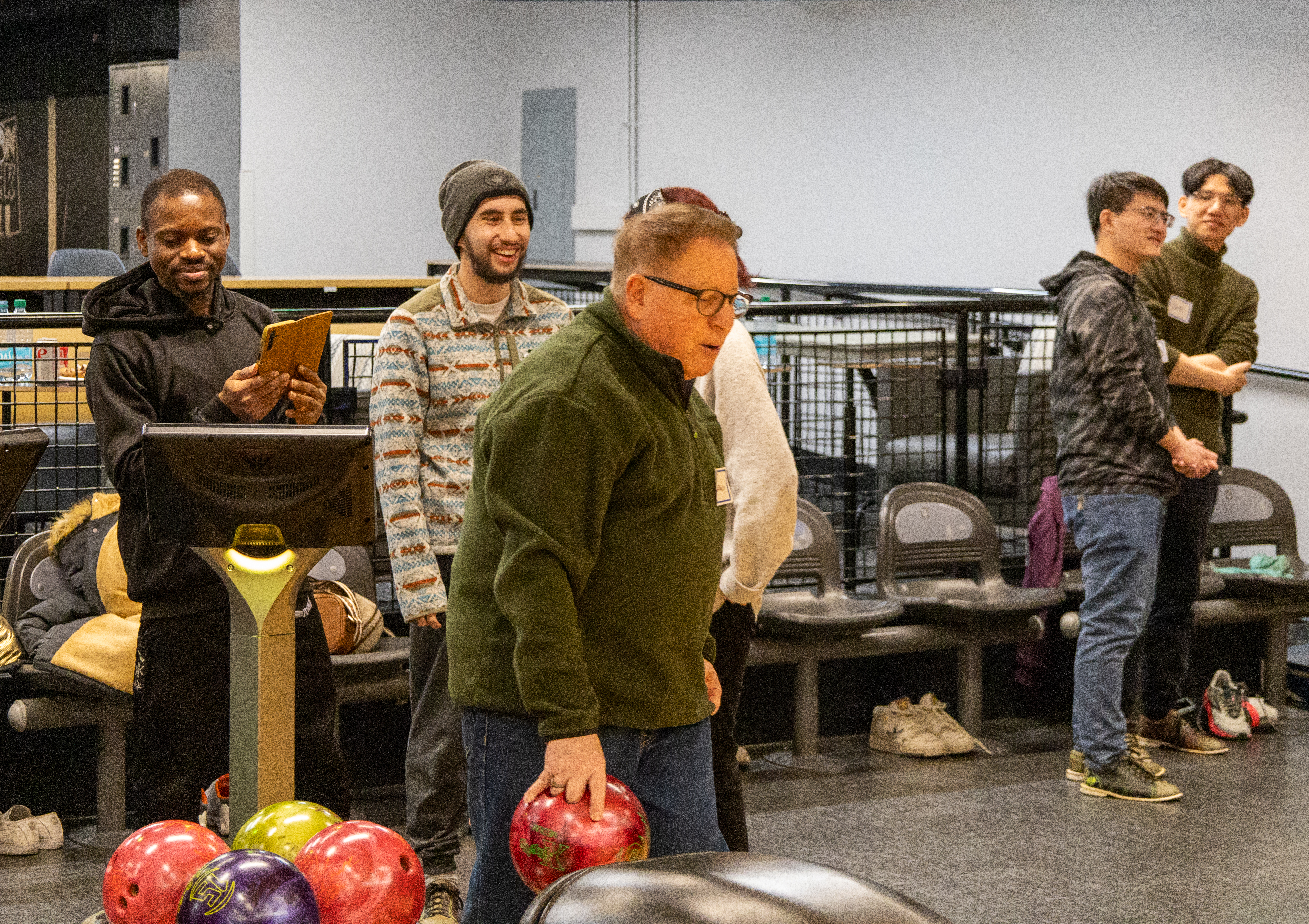 IFP students and hosts enjoying bowling together.