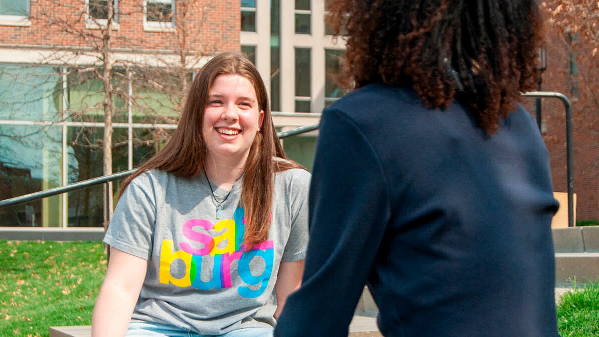 Two students talking outside. 