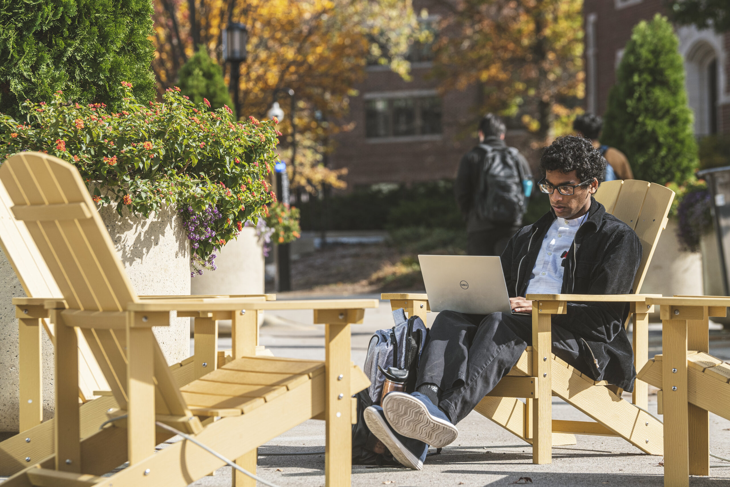 Student Studying outside in a chair