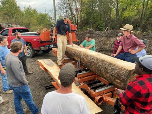 Prof. Gazo demonstrates hardwood log grade-sawing process on a portable Woodmizer sawmill.