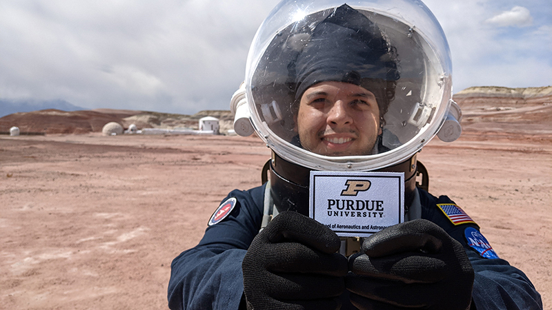 Purdue University’s Julio Hernández while in Utah on his MDRS analog mission, simulating life on Mars and displaying Purdue pride