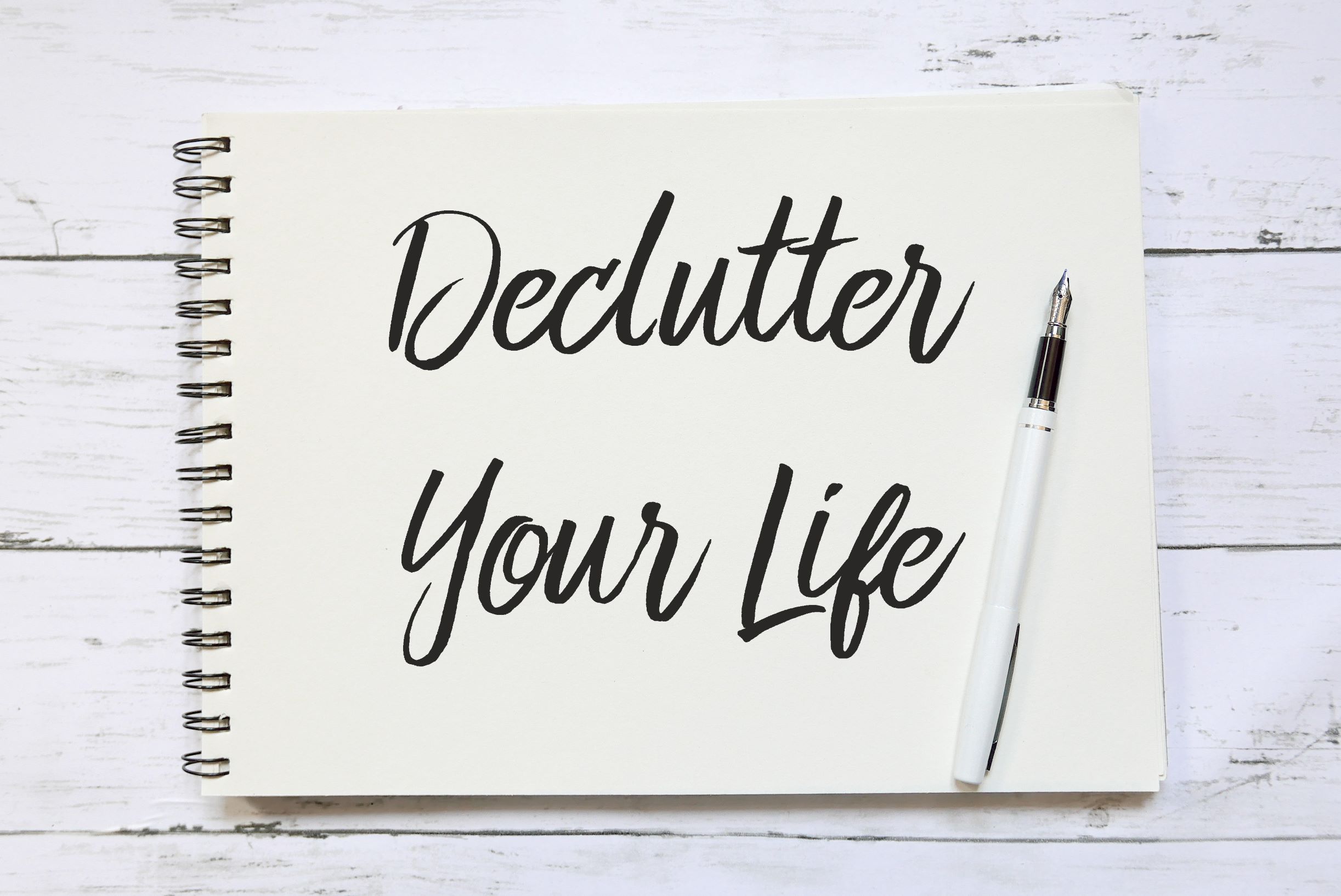Declutter Your Life with pen on a tablet of paper