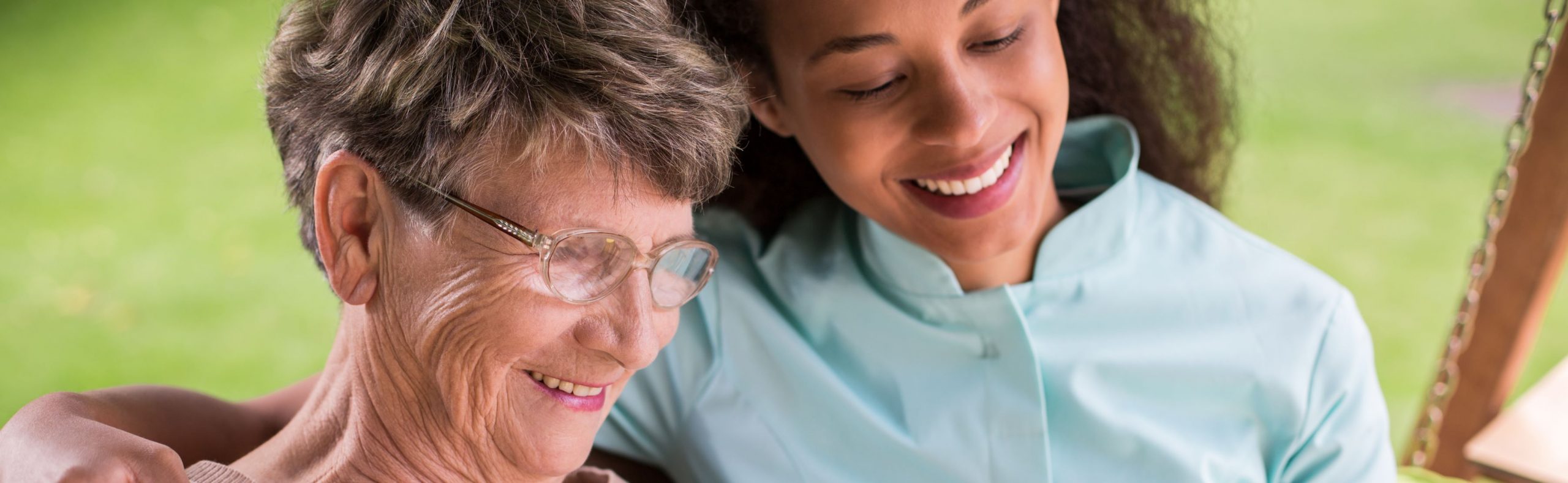 Caregiver assisting a retired person a long-term care facility.