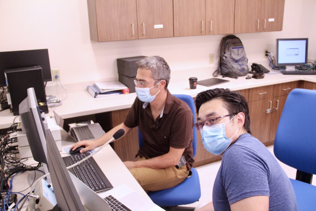 Uzay Emir and Xin Shen work in the Purdue Life Science MRI Facility.