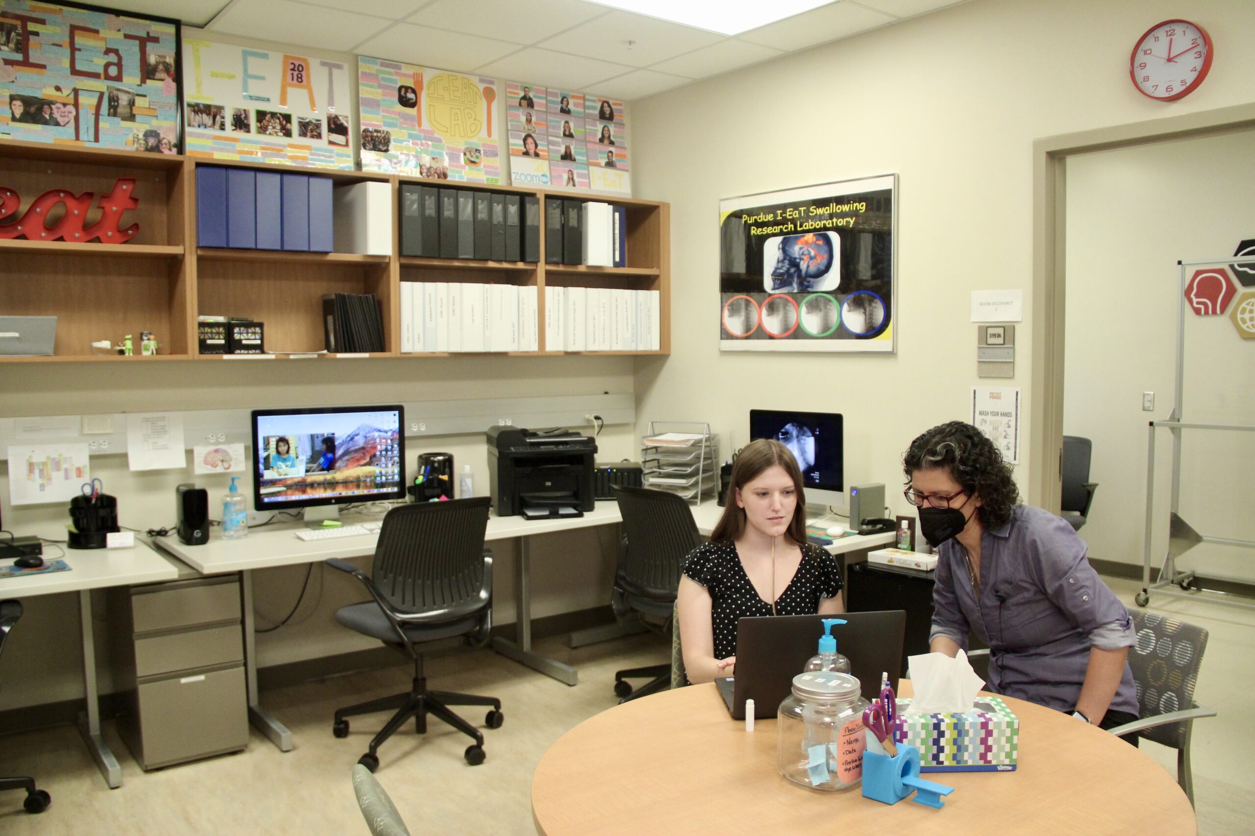 Georgia Malandraki and graduate student Jennine Bryan work in the I-EaT Lab.