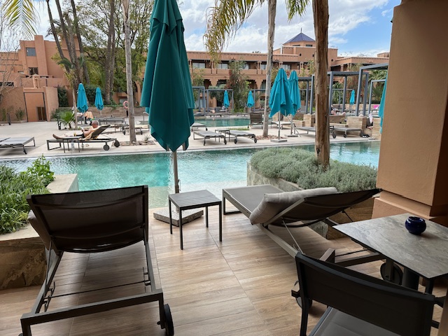 View of a swimming pool outside of a hotel room