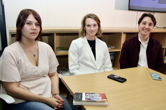 Purdue Psychological Sciences PhD students sit and pose for a picture.