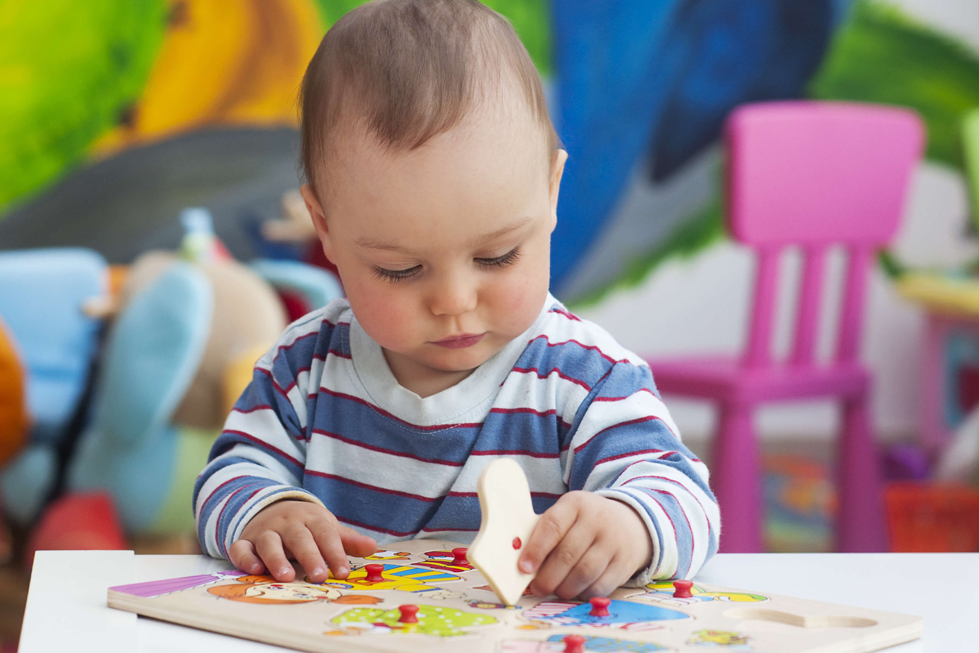 toddler playing with a puzzle