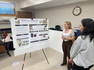 Stephanie Castano presenting her research poster on smart composting bins.