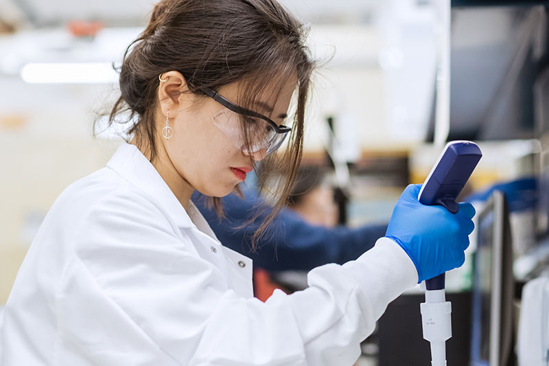 Yirang Park, a Purdue University trainee, prepares a sample of vials for characterization in a lyophilization facility at Discovery Park District at Purdue.