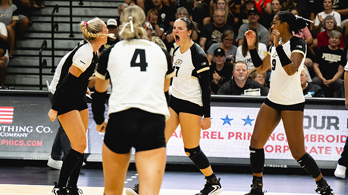 Players from Purdue Women’s Volleyball on the volleyball court.