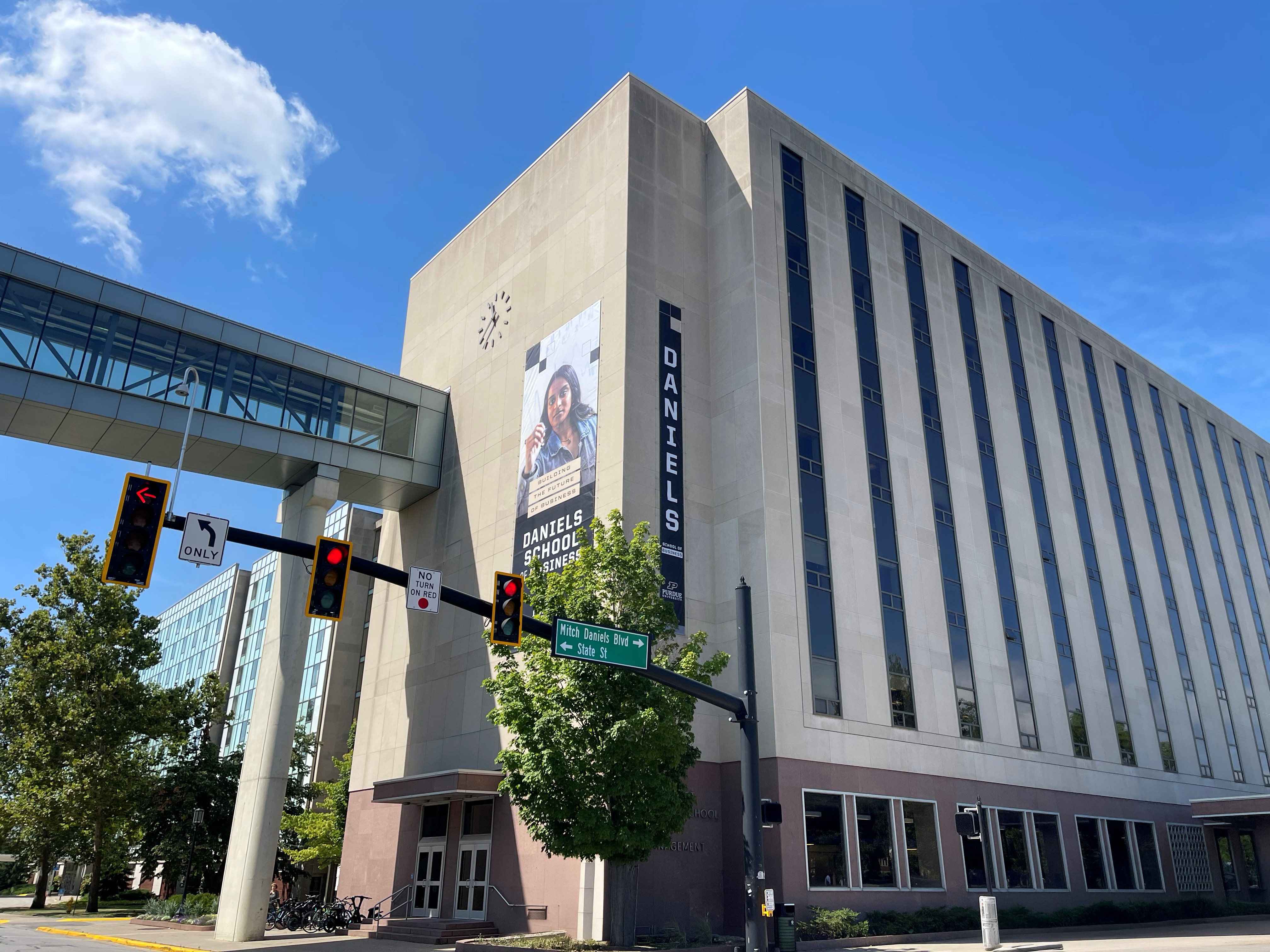 An academic building at Purdue with Daniels School of Business on a banner 