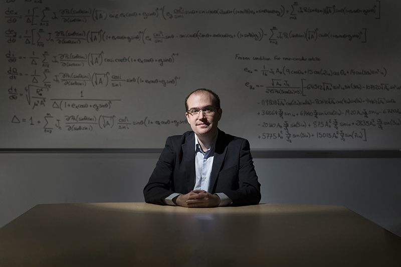 David Arnas sitting in a classroom.