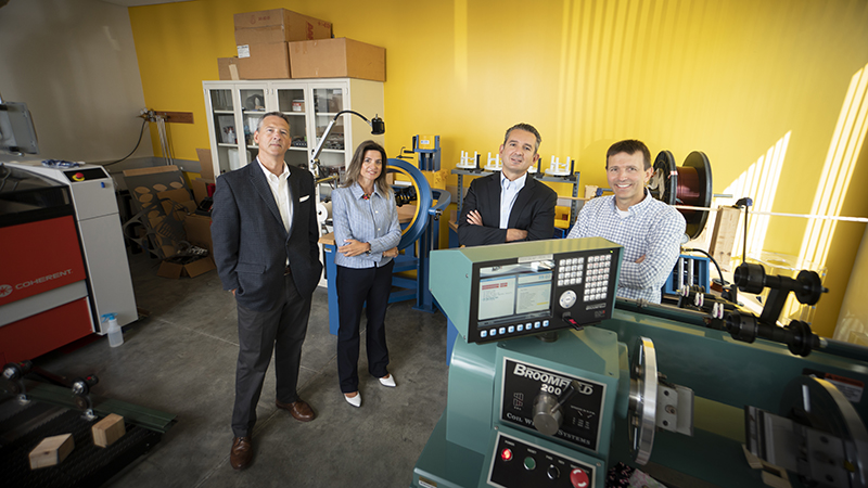 Purdue engineers standing in a lab.