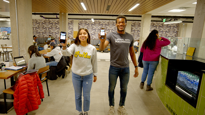 Ruby Foster and Ohinoiyi David Momoh showing off Purdue Mobile ID.