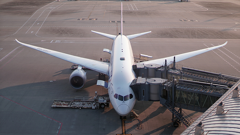 Airplane parked by a terminal