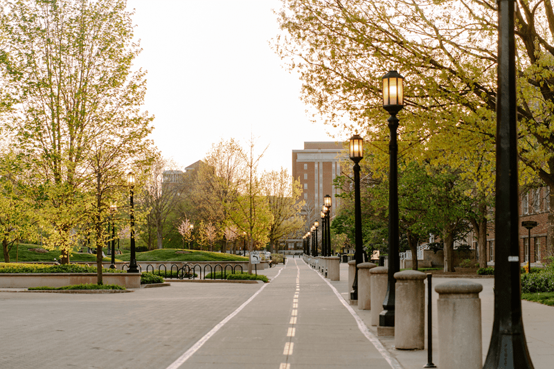 Sidewalk, light posts, and trees at Purdue