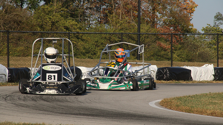 Students driving karts for the Halloween Hundred