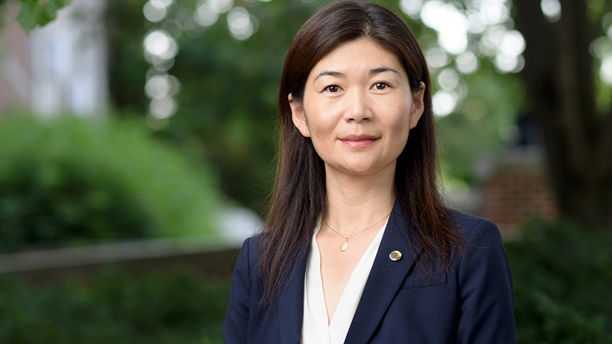 Portrait of Luna Lu with trees in the background.