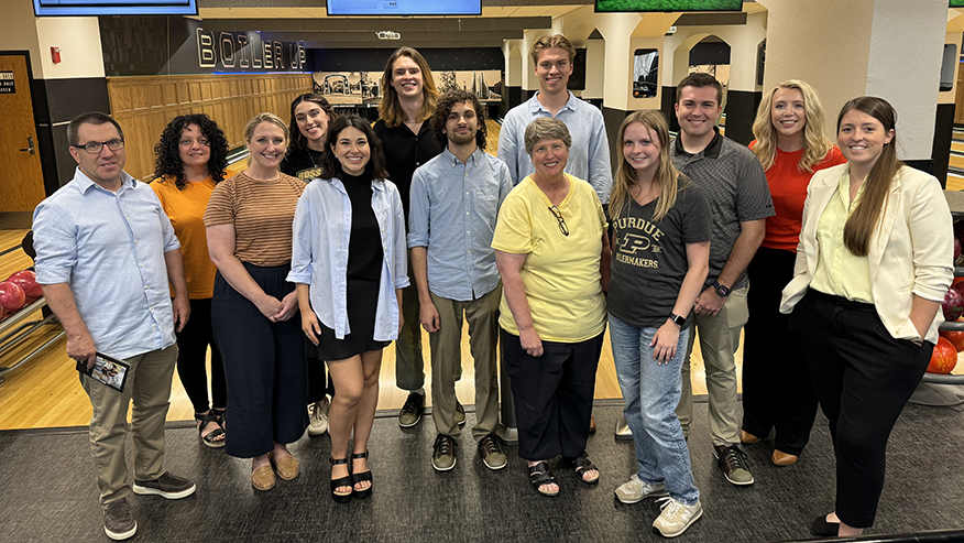 A group poses for a photo at the Union Rack and Roll bowling alley.