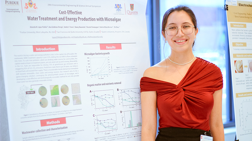 Amanda Lopez, a PhD candidate in Purdue’s Environmental and Ecological Engineering program, stands in front of her research poster.