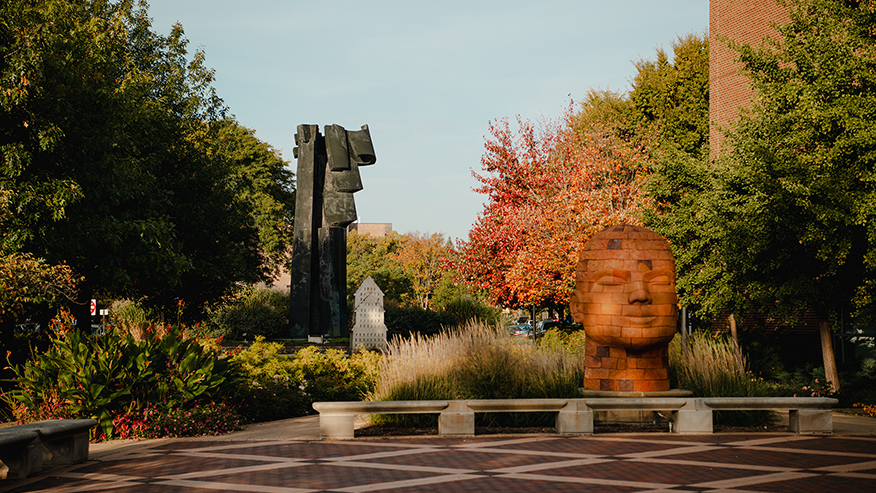 A fall view of a “Brickhead” sculpture near Purdue University’s Pao Hall of Visual and Performing Arts.