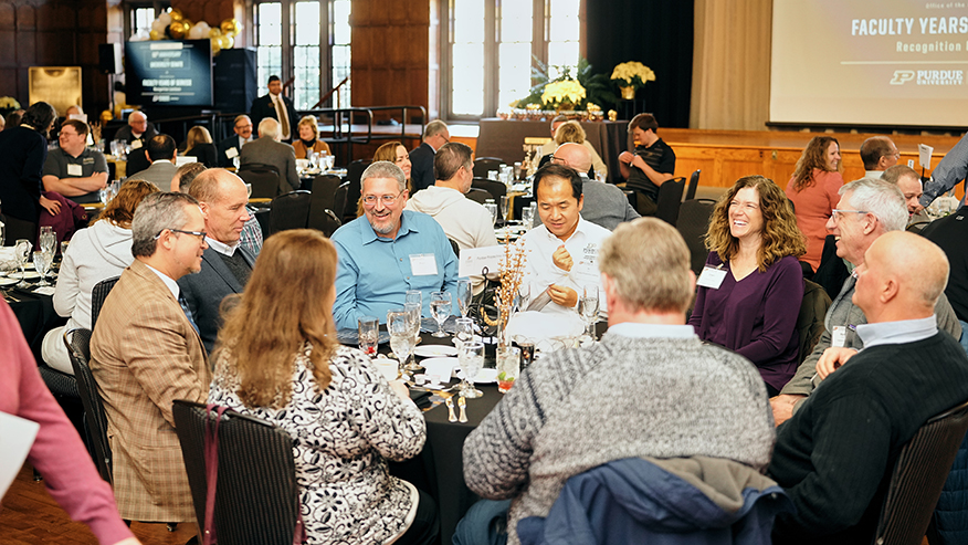 Group of people at banquet recognizing academic professionals