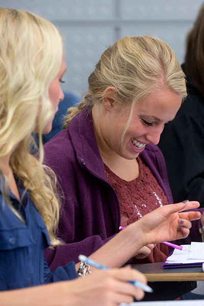 Two young women studying