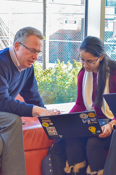 A man in a conversation with a student