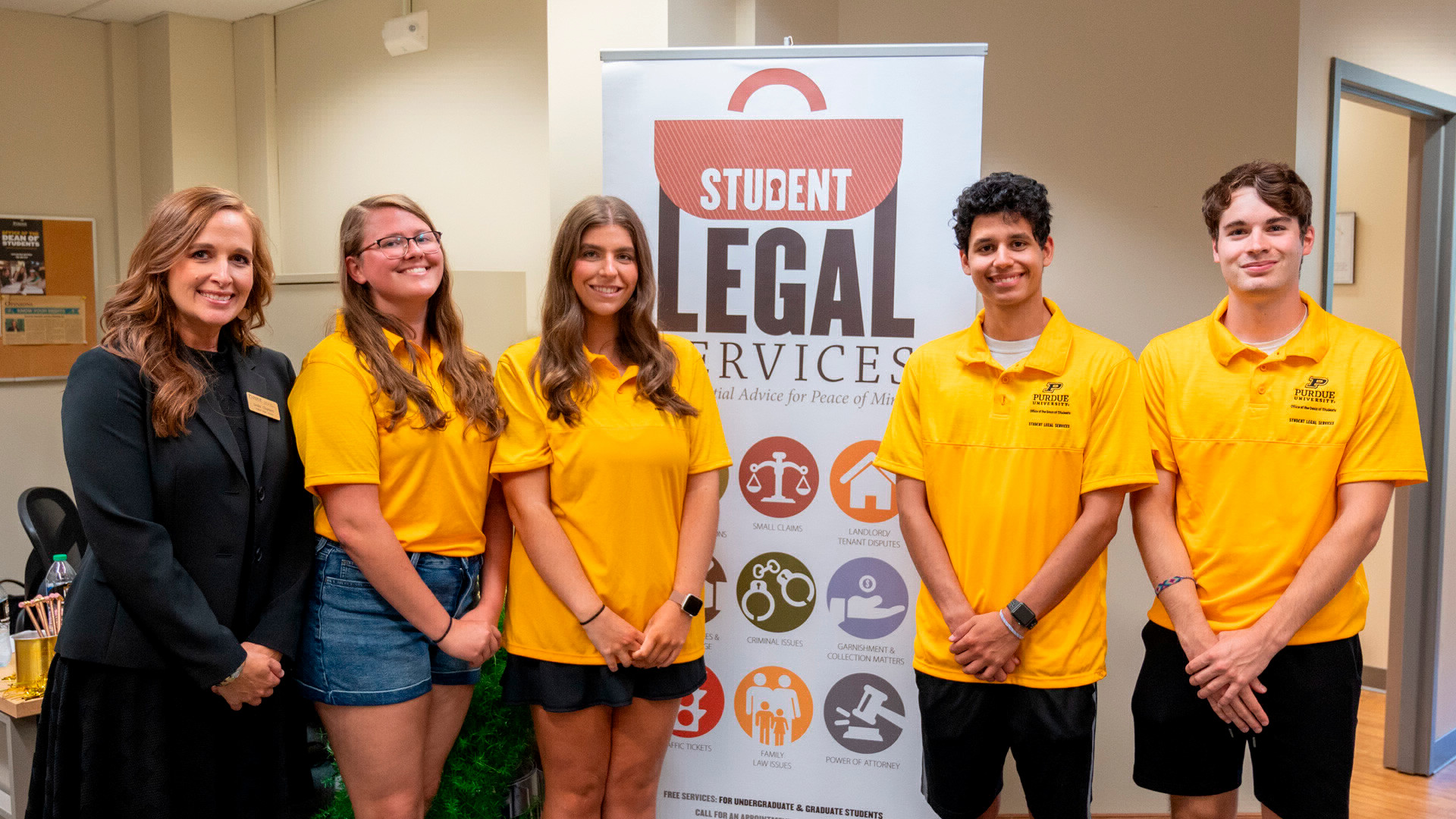 Leslie Charter and Student Legal Services (SLS) Ambassadors pose for the camera during SLS's 10 year anniversary celebration event. 