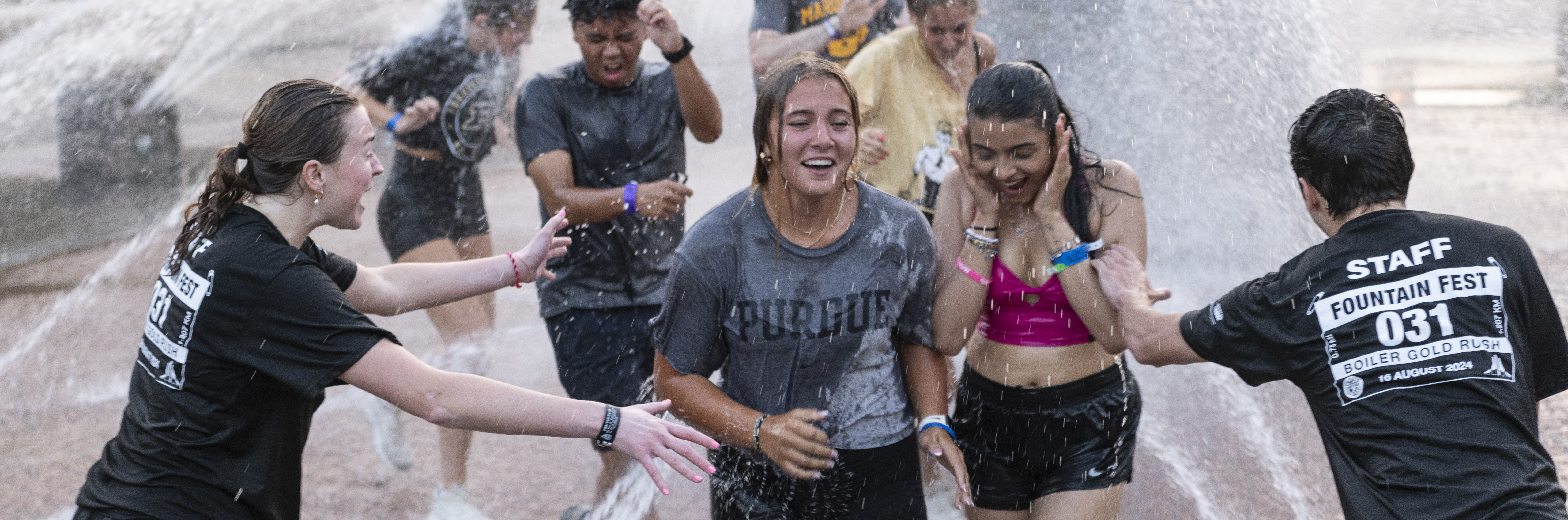 picture of many students standing together cheering