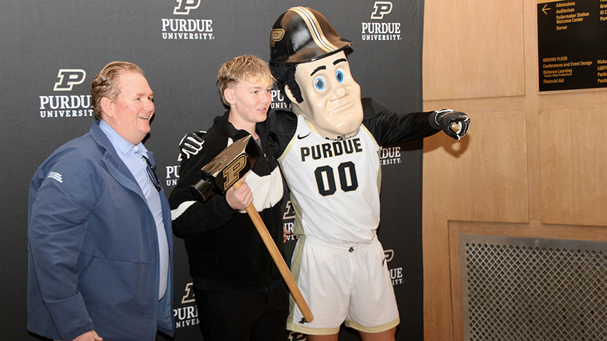 image of Purdue Pete posing with two people