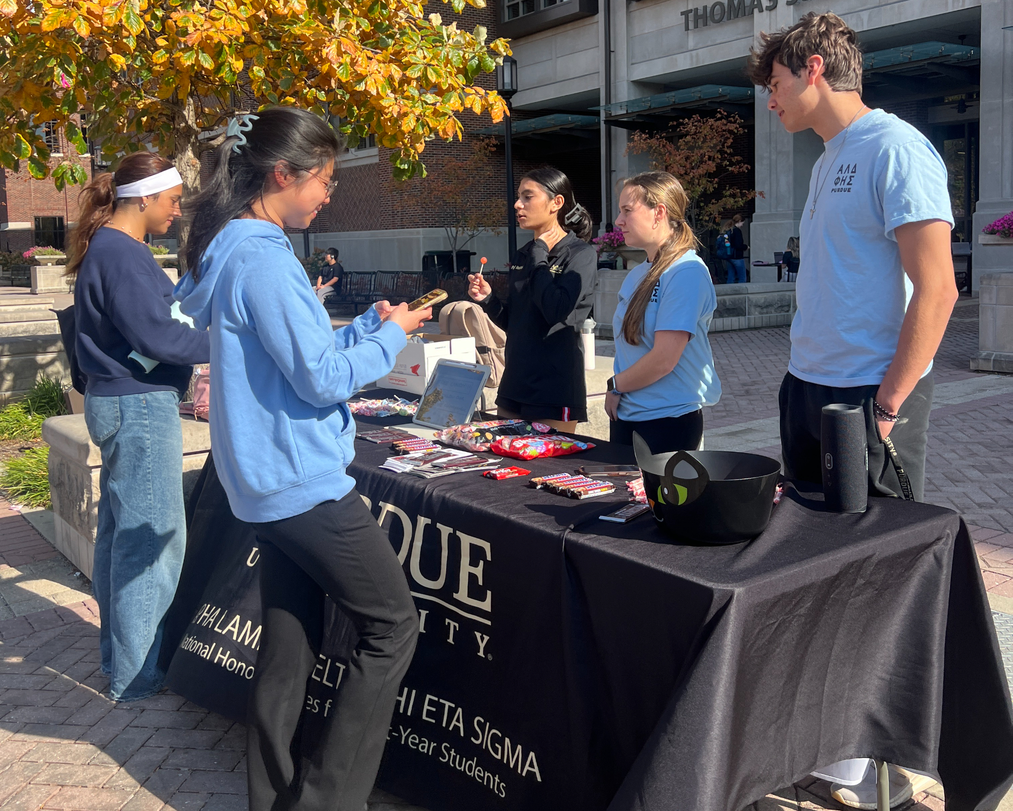 Group of students at outdoor tabling event