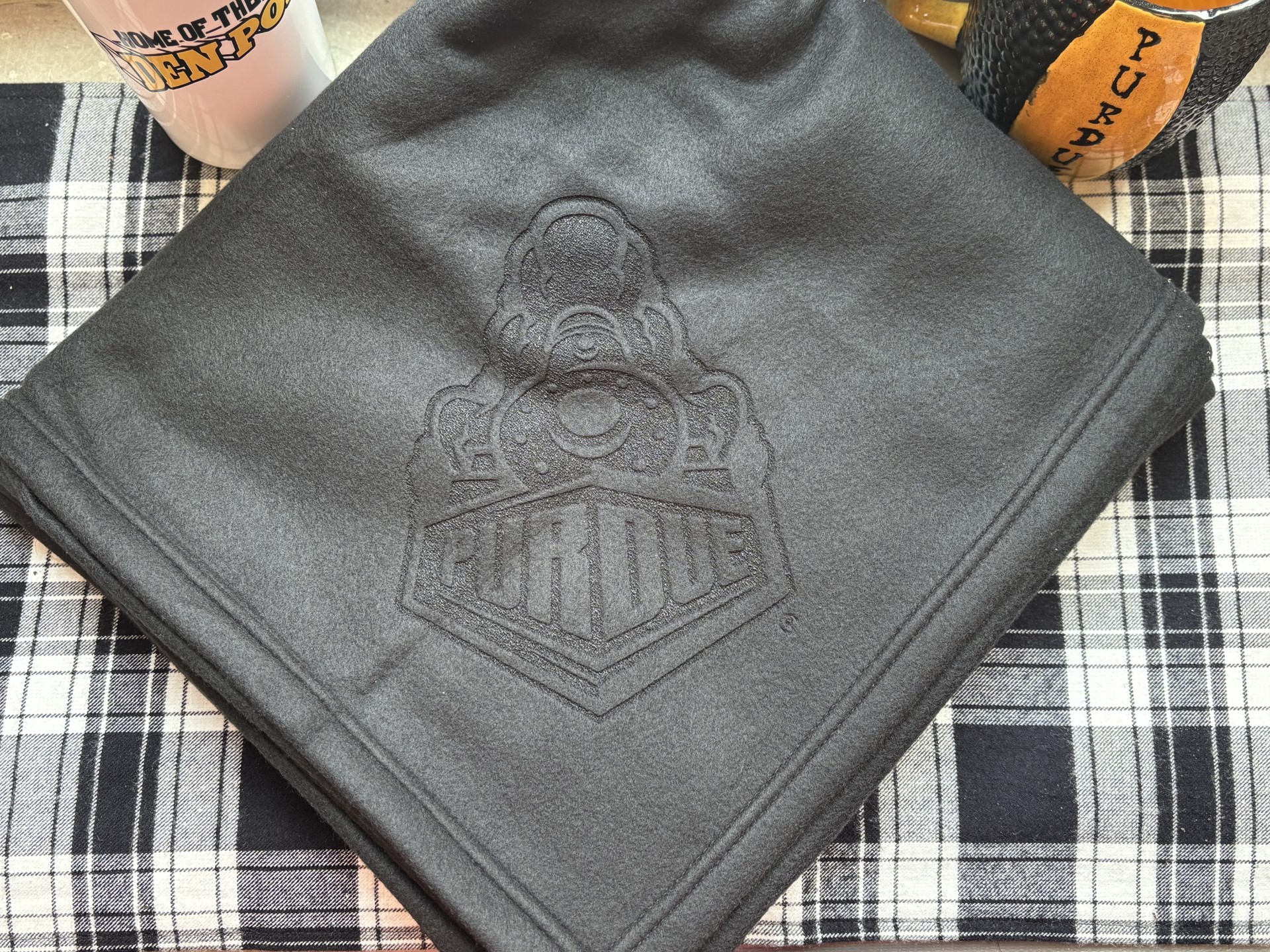 photo of black blanket with Boilermaker Special etched on corner