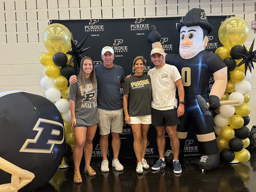 Henry family with an inflatable Purdue Pete and Inflatable football helmet