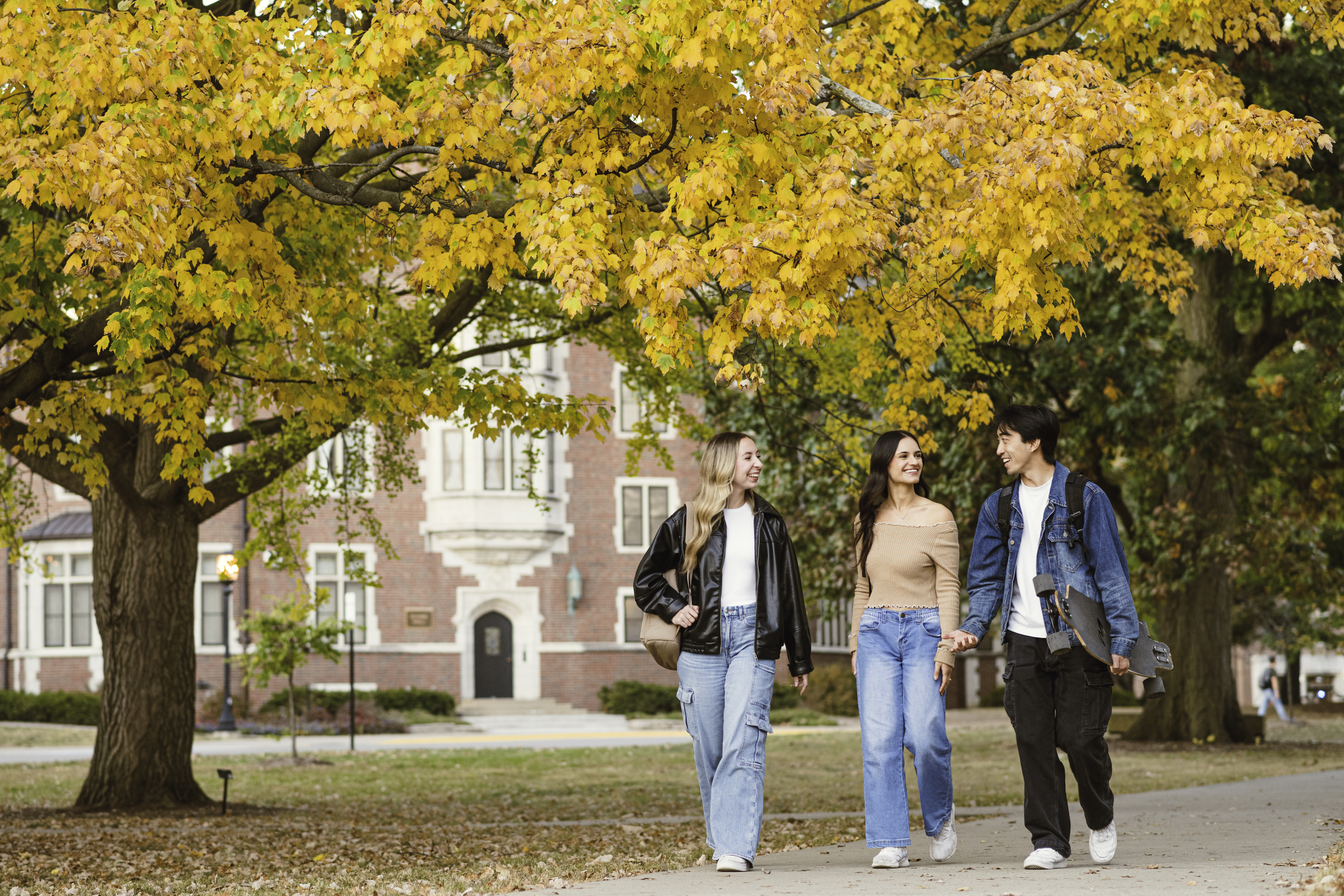 Students strolling in fall
