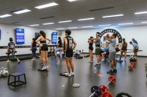 F45 Members in session watching guidance screens