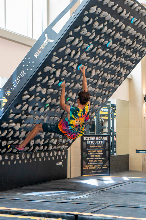 Climber on kilter board