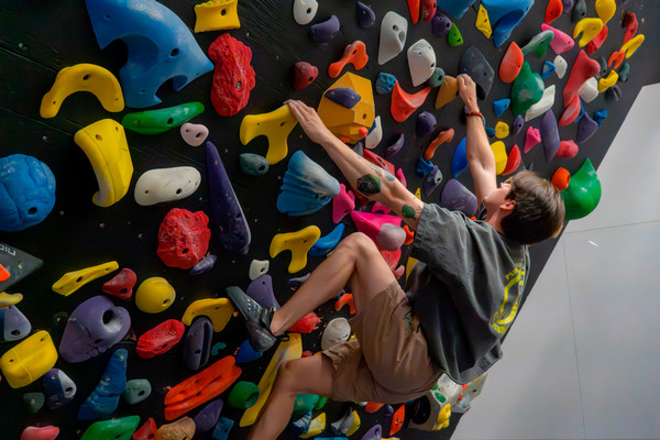Climber on spray wall