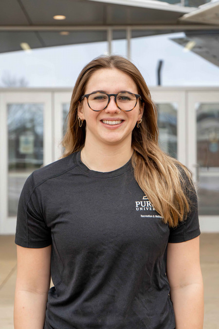 Outdoor headshot of personal trainer