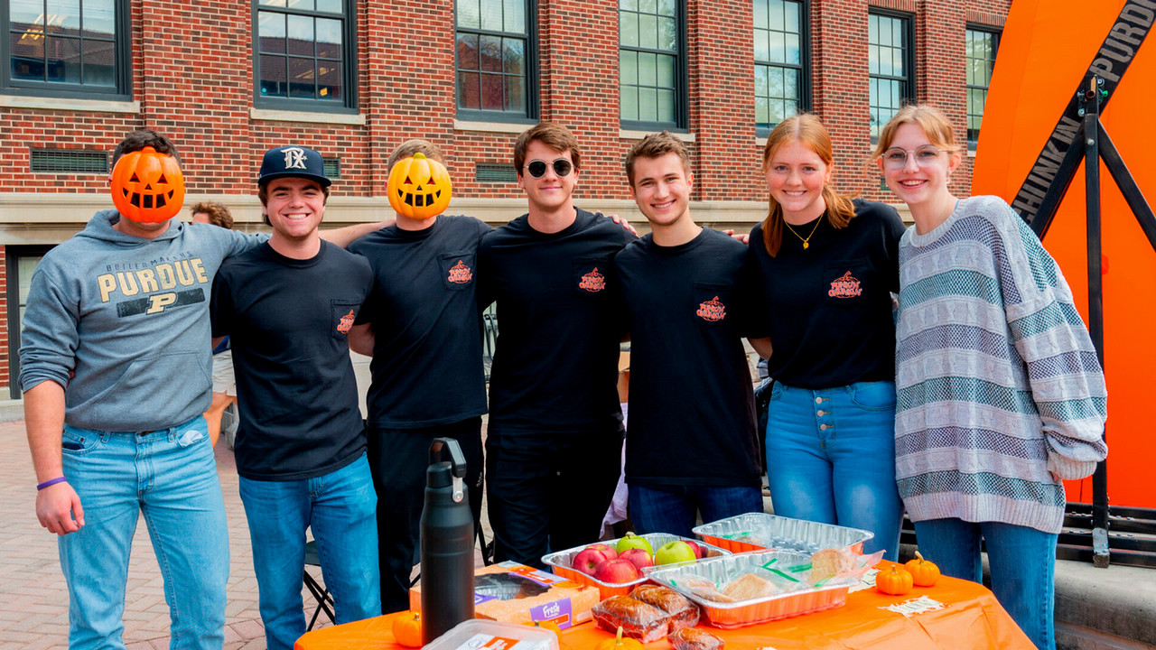 Students from the Punkin Chunkin Club pose for a photo during their bake sale. 