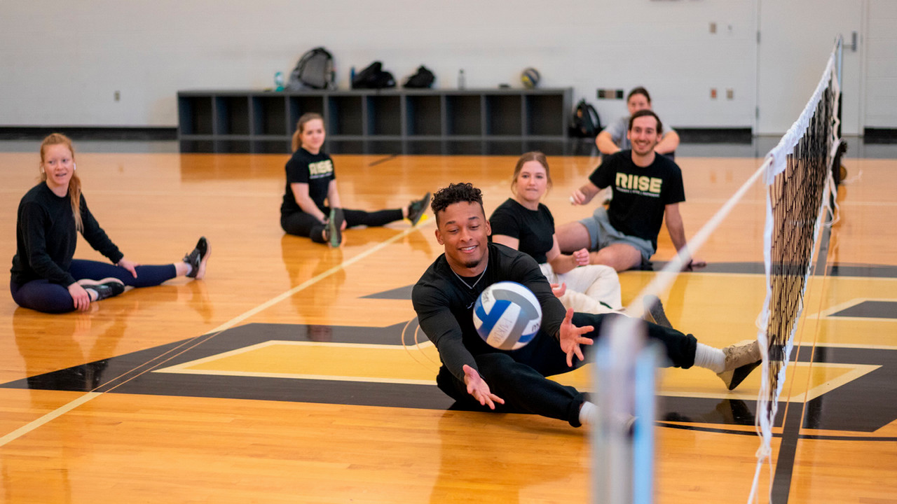 Students playing volleyball