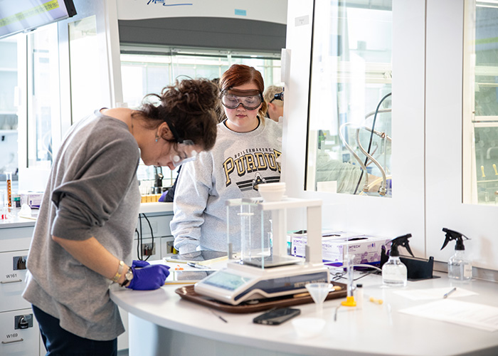 Two undergraduate students engage in hands-on learning in a state-of-the-art lab classroom at Chaney Hale Hall of Science, fostering discovery and innovation at Purdue University.