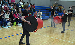 Physics student volunteers Katie Bowen and Cassidy Ames duke it out with their vortex cannons