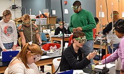 Students working on a lab with Science Express equipment.