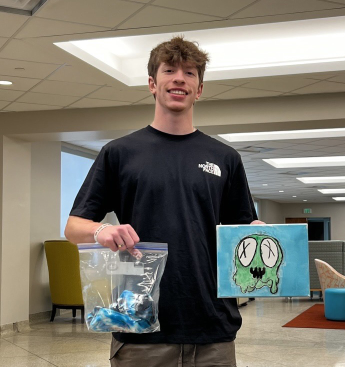 Student taking part in a painting activity