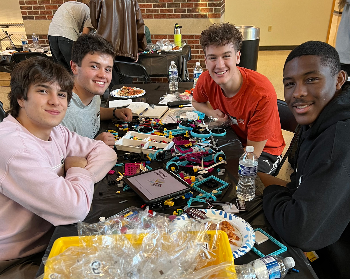 Students at a table during a LEGO event