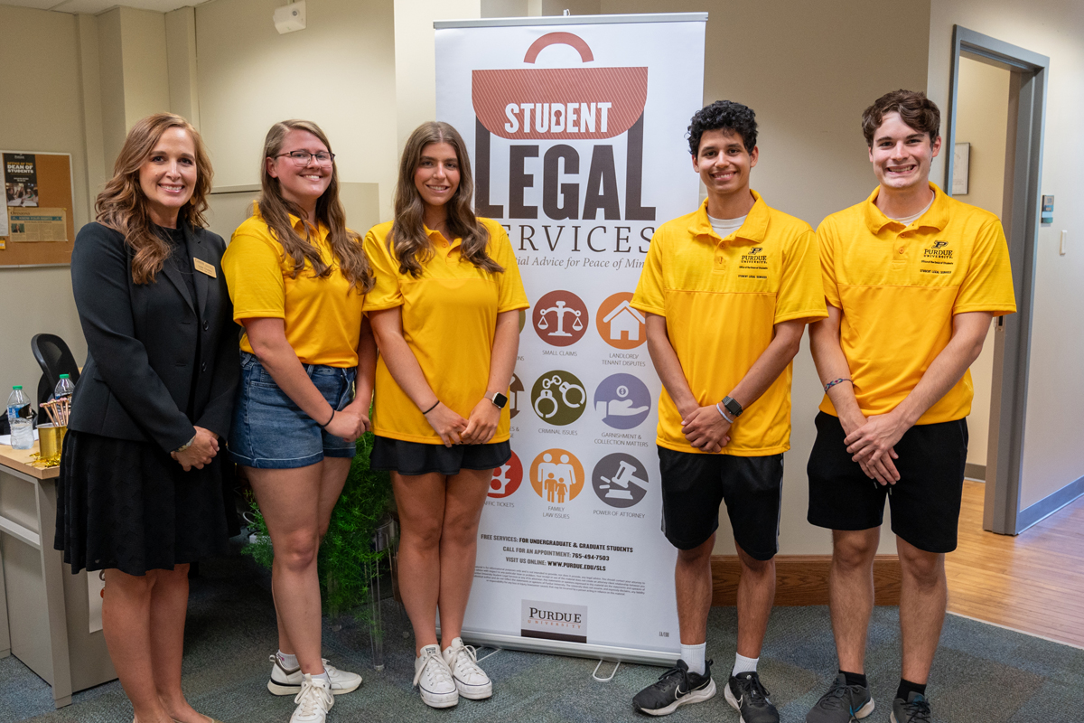 Leslie Charters, Director of Student Legal Services, celebrates with students during the SLS 10 Year Celebration ceremony.