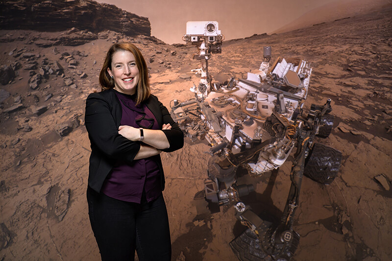 Horgan with backdrop of planet, rover